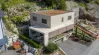 Dreistöckiges Haus mit Garageneinfahrt